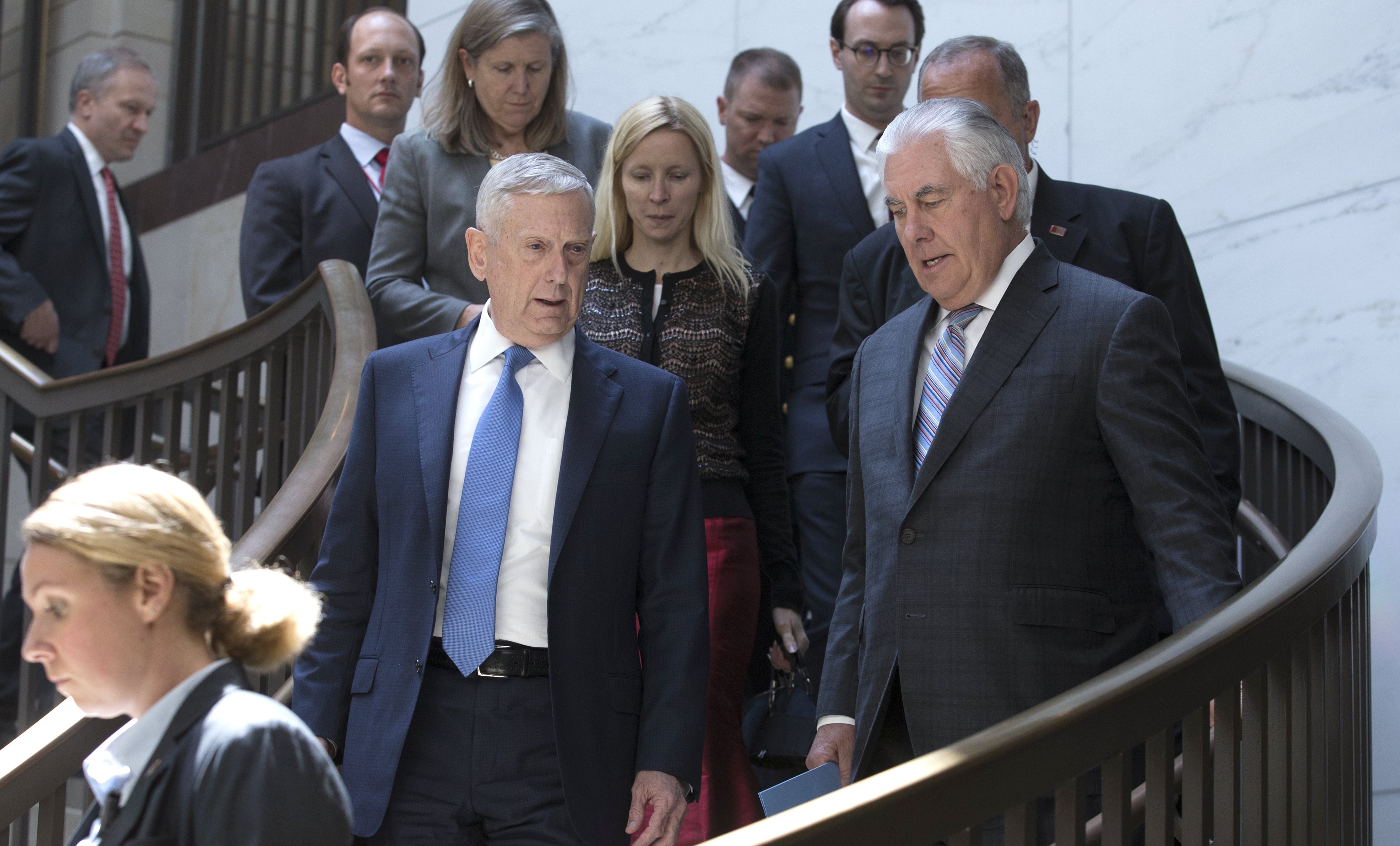 epa06121811 US Secretary of Defense James Mattis (C-L) and US Secretary of State Rex Tillerson (C-R) walk to the Senate Foreign Relations Committee closed briefing entitled 'Authorizations for the Use of Military Force - Administration Perspective', on Capitol Hill in Washington, DC, USA, 02 August 2017.  EPA/MICHAEL REYNOLDS