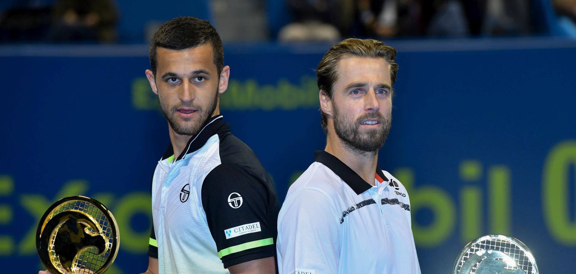 epa06419092 Mate Pavic of Croatia (L) and Oliver March of Austria (R) pose with the trophy after winning the ATP Qatar Open Tennis tournament doubles final against Jamie Murray of Britain and Bruno Soares of Brazil at the Khalifa International Tennis Complex in Doha, Qatar, 05 January 2018.  EPA/NOUSHAD THEKKAYIL