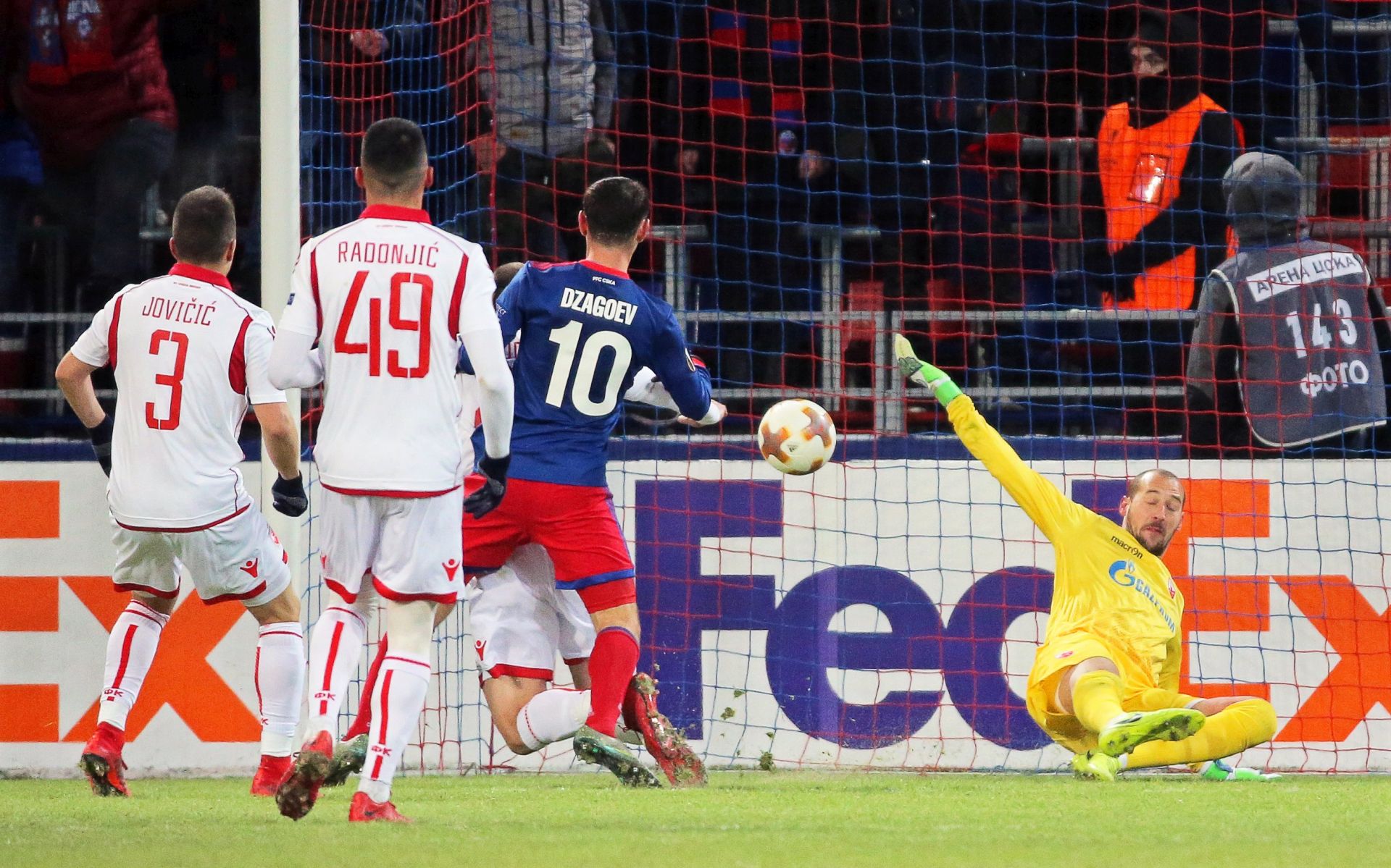 epa06551041 Alan Dzagoev (C) of CSKA Moscow scores the 1-0 lead against Red Star's goalkeeper Milan Borjan (R) during the UEFA Europa League round of 32, second leg soccer match between CSKA Moscow and Red Star Belgrade in Moscow, Russia, 21 February 2018.  EPA/MAXIM SHIPENKOV