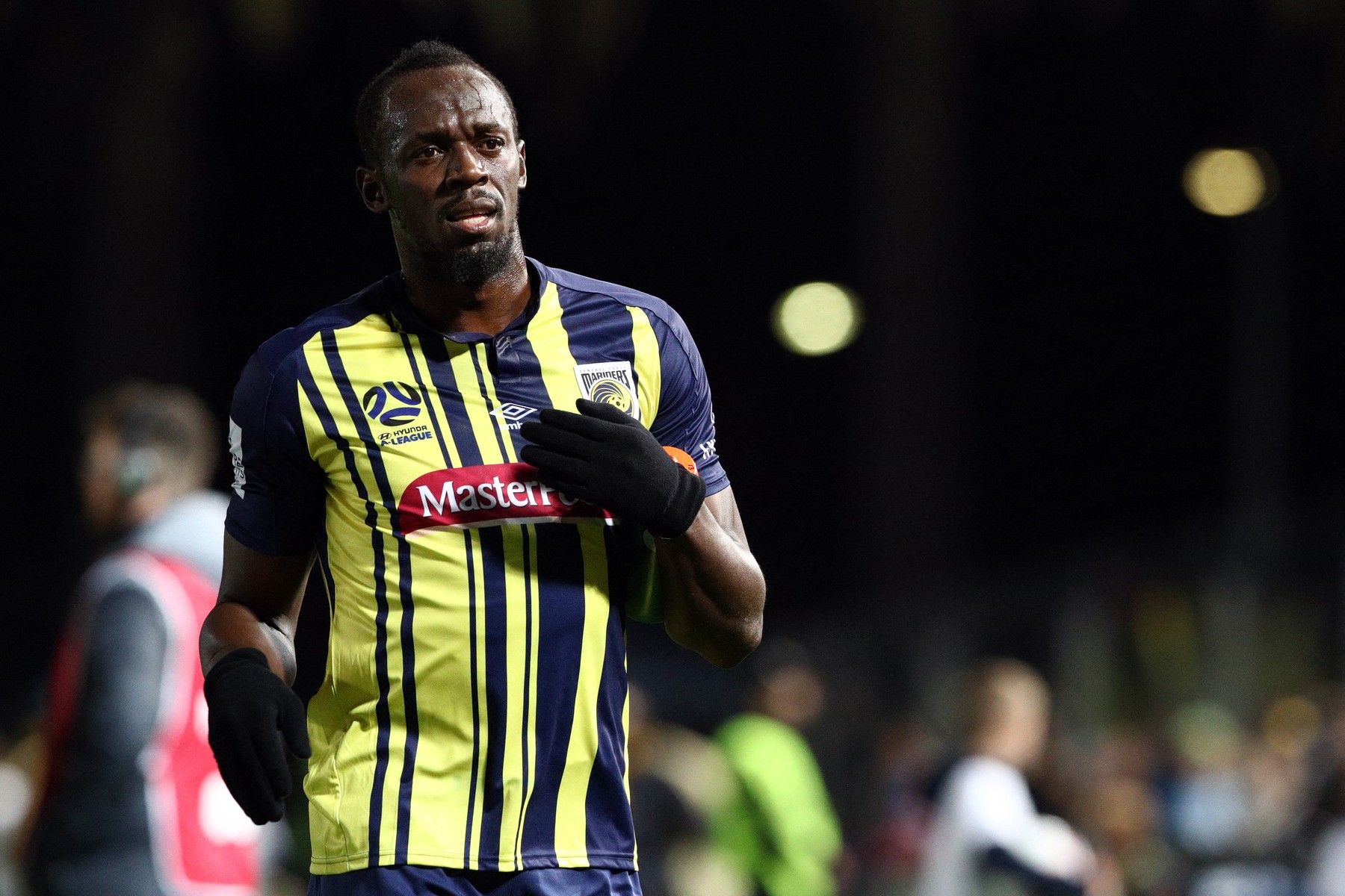 Olympic sprinter Usain Bolt gestures as he plays for A-League football club Central Coast Mariners in a pre-season practice match against a Central Coast amateur selection team in Gosford, New South Wales on August 31, 2018. Sprint king Usain Bolt made his much-anticipated football debut on August 31, exciting fans but tiring quickly in a 20-minute cameo as his Central Coast Mariners hammered an amateur side 6-1 in a pre-season warm-up.,Image: 384786334, License: Rights-managed, Restrictions: -- IMAGE RESTRICTED TO EDITORIAL USE - STRICTLY NO COMMERCIAL USE --, Model Release: no, Credit line: Andrew Murray / AFP / Profimedia