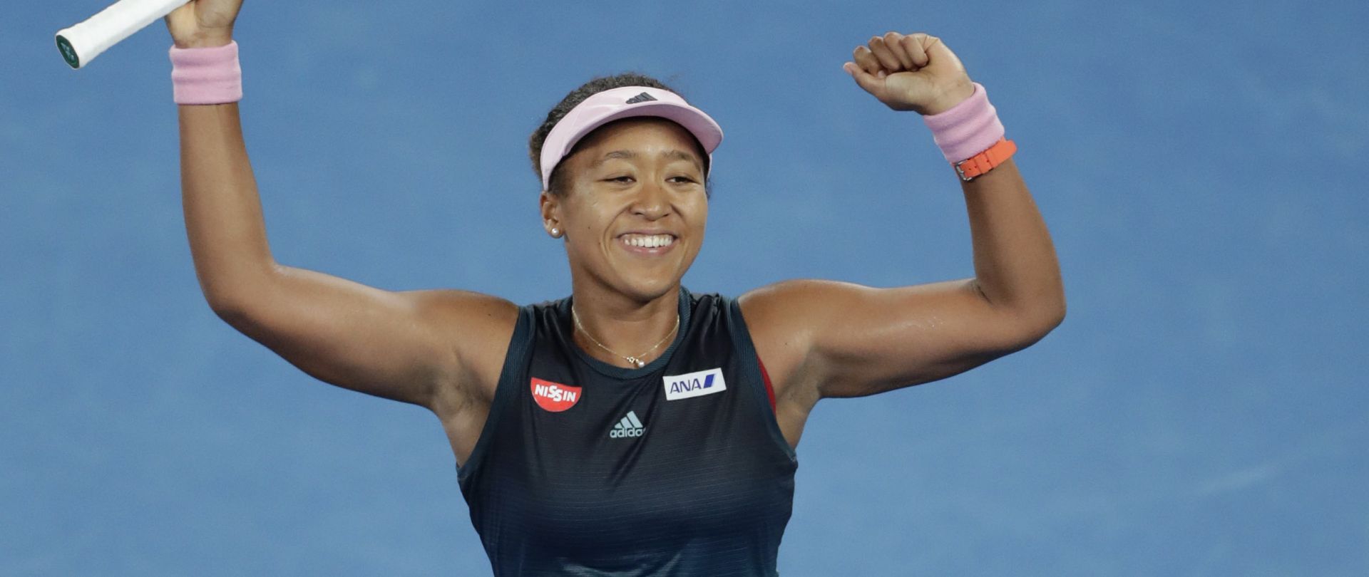 epa07314379 Naomi Osaka of Japan celebrates winning her women's singles semifinal match against Karolina Pliskova of Czech Republic at the Australian Open Grand Slam tennis tournament in Melbourne, Australia, 24 January 2019.  EPA/LYNN BO BO