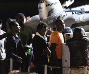 epa07704696 Migrants disembark from an Italian Guardia di Finanza (GdF) ship in Pozzallo, Sicily Island, southern Italy, 09 July 2019.  A total of 53 migrants were rescued on a boat in the Sicilian Channel by a Coast Guard patrol boat, but six of them were immediately transferred to Lampedusa due to medical problems.  EPA/FRANCESCO RUTA