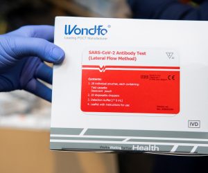 epa08345308 A health worker shows one of the boxes containing 20 coronavirus fast tests in Seville, Spain, 06 April 2020. A total of 130,000 tests arrived to Andalusia, southern Spain, to be distributed amongst hospitals in the region. Spain faces the 23rd consecutive day of mandatory home confinement in a bid to slow down the spread of the pandemic COVID-19 disease caused by the SARS-CoV-2 coronavirus.  EPA/Raul Caro