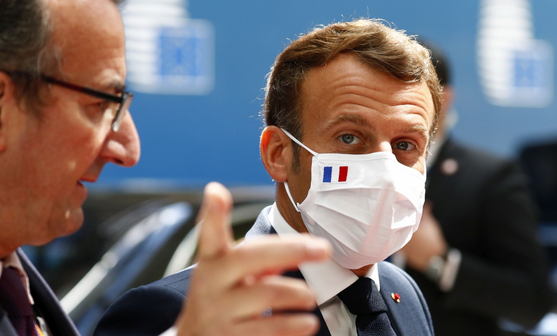 epa08556168 French President Emmanuel Macron arrives for the fourth day of the European Council meeting in Brussels, Belgium, 20 July 2020. European Union nations leaders meet face-to-face for a fourth day to discuss plans responding to coronavirus crisis and new long-term EU budget.  EPA/FRANCOIS LENOIR / POOL