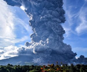 epa08594601 (FILE) - Mount Sinabung spews volcanic smoke in Tiga Pancur Village, Karo, North Sumatra, Indonesia, 09 June 2019 (reissued 10 August 2020). According to latest media reports, Mount Sinabung, one of the most active volcanoes in Indonesia, erupted on 10 August spewing a column of volcanic ash high into the sky. Indonesia sits on the Pacific Ring of Fire, which accounts for 80 percent of the world's seismic activity.  EPA/SARIANTO SEMBIRING