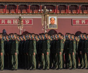 epa08767062 Chinese paramilitary police officers gather on Tiananmen Square to attend the event at the Great Hall of the People marking the 70th anniversary of China's entry into the Korean war, in Beijing, China, 23 October 2020.  EPA/ROMAN PILIPEY