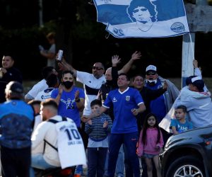 epa08787166 Supporters of Gimnasia y Esgrima cheer prior to the first match of La Liga Argentina soccer tournament between Gimnasia y Esgrima and Patronato at Juan Carmelo Zerillo stadium in La Plata, Argentina, 30 October 2020. Maradona, head coach of Gimnasia y Esgrima, turns 60 on 30 October.  EPA/DEMIAN ALDAY ESTEVEZ