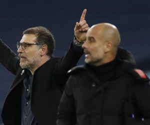 epa08886420 West Bromwich's manager Slaven Bilic (L) gives instructions to his players as Manchester City's manager Pep Guardiola (R) follows the game during the English Premier League match between Manchester City vs West Bromwich Albion FC in Manchester, Britain, 15 December 2020.  EPA/Clive Brunskill / POOL EDITORIAL USE ONLY. No use with unauthorized audio, video, data, fixture lists, club/league logos or 'live' services. Online in-match use limited to 120 images, no video emulation. No use in betting, games or single club/league/player publications.