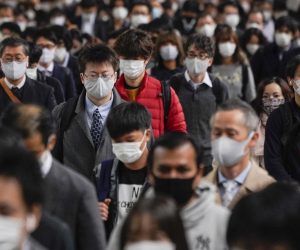 epa08897237 (FILE) - (FILE) Commuters walk to work after exiting from their packed commuter trains at Shinagawa railway station in Tokyo, Japan, 24 November 2020 (reissued 21 December 2020). According to latest media reports, the total number of coronavirus disease (COVID-19) infections in Japan has exceeded the 200,000 mark since the start of the pandemic.  EPA/KIMIMASA MAYAMA