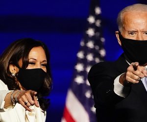 epa08876558 (FILE) - Vice President-Elect Kamala Harris (L) and President-elect Joe Biden (R) gesture as they arrive for their victory address after being declared the winners in the 2020 US presidential election, in Wilmington, Delaware, USA, 07 November 2020 (reissued 11 December 2020). Time magazine has named Joe Biden and Kamala Harris 2020's Person of the Year.  EPA/JIM LO SCALZO