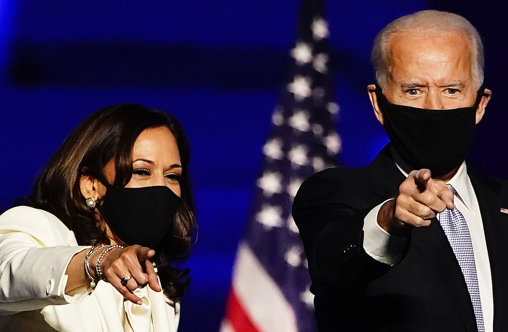 epa08876558 (FILE) - Vice President-Elect Kamala Harris (L) and President-elect Joe Biden (R) gesture as they arrive for their victory address after being declared the winners in the 2020 US presidential election, in Wilmington, Delaware, USA, 07 November 2020 (reissued 11 December 2020). Time magazine has named Joe Biden and Kamala Harris 2020's Person of the Year.  EPA/JIM LO SCALZO