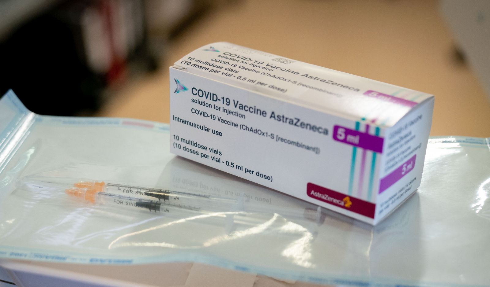 epa09000842 Syringes and a package with the COVID-19 vaccine from AstraZeneca are displayed at the fourth vaccination centre in Berlin at Tegel Airport, Germany, 10 February 2021. At the beginning, mainly nursing staff and medical personnel will be vaccinated against COVID-19 here.  EPA/KAY NIETFELD / POOL