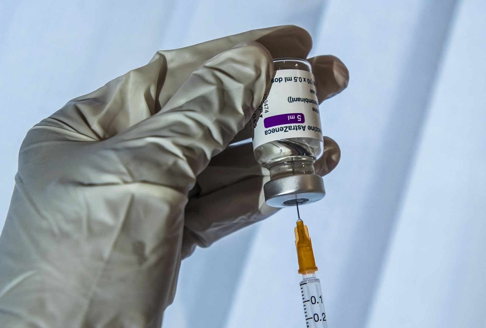 epa09038092 A doctor prepares his syringe with a dose of Oxford Astra-Zeneca COVID-19 vaccine  before a first vaccine injection in Paris, France, 26 February, 2021. France begins vaccination of people aged 50 to 64 with Astrazeneca anti-covid19 vaccine as allowing doctors to vaccinate in their doctor's offices as the country is in the midst of a new wave of coronavirus (COVID-19) infections as the number of cases is increasing day by day.  EPA/CHRISTOPHE PETIT TESSON