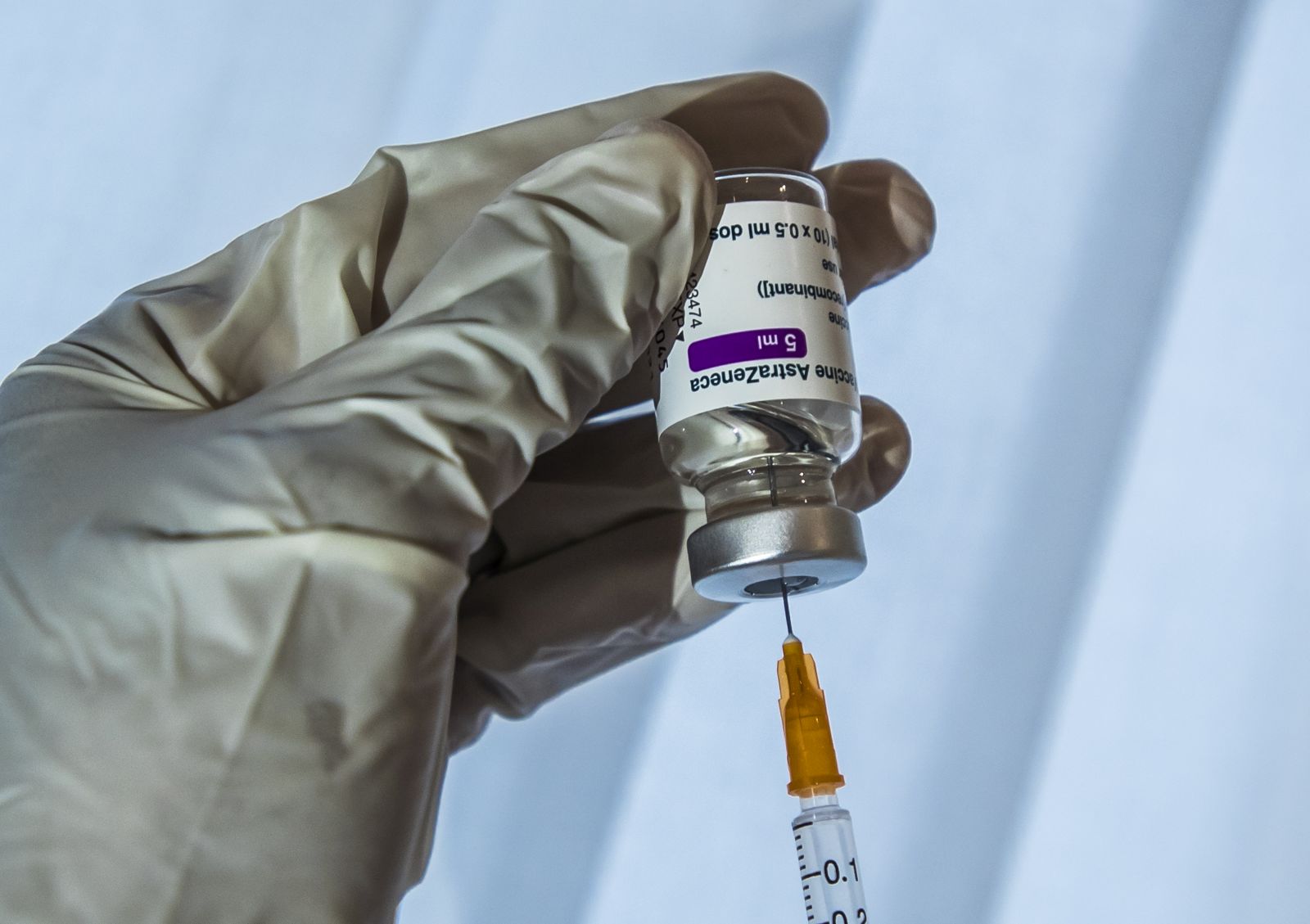 epa09038092 A doctor prepares his syringe with a dose of Oxford Astra-Zeneca COVID-19 vaccine  before a first vaccine injection in Paris, France, 26 February, 2021. France begins vaccination of people aged 50 to 64 with Astrazeneca anti-covid19 vaccine as allowing doctors to vaccinate in their doctor's offices as the country is in the midst of a new wave of coronavirus (COVID-19) infections as the number of cases is increasing day by day.  EPA/CHRISTOPHE PETIT TESSON