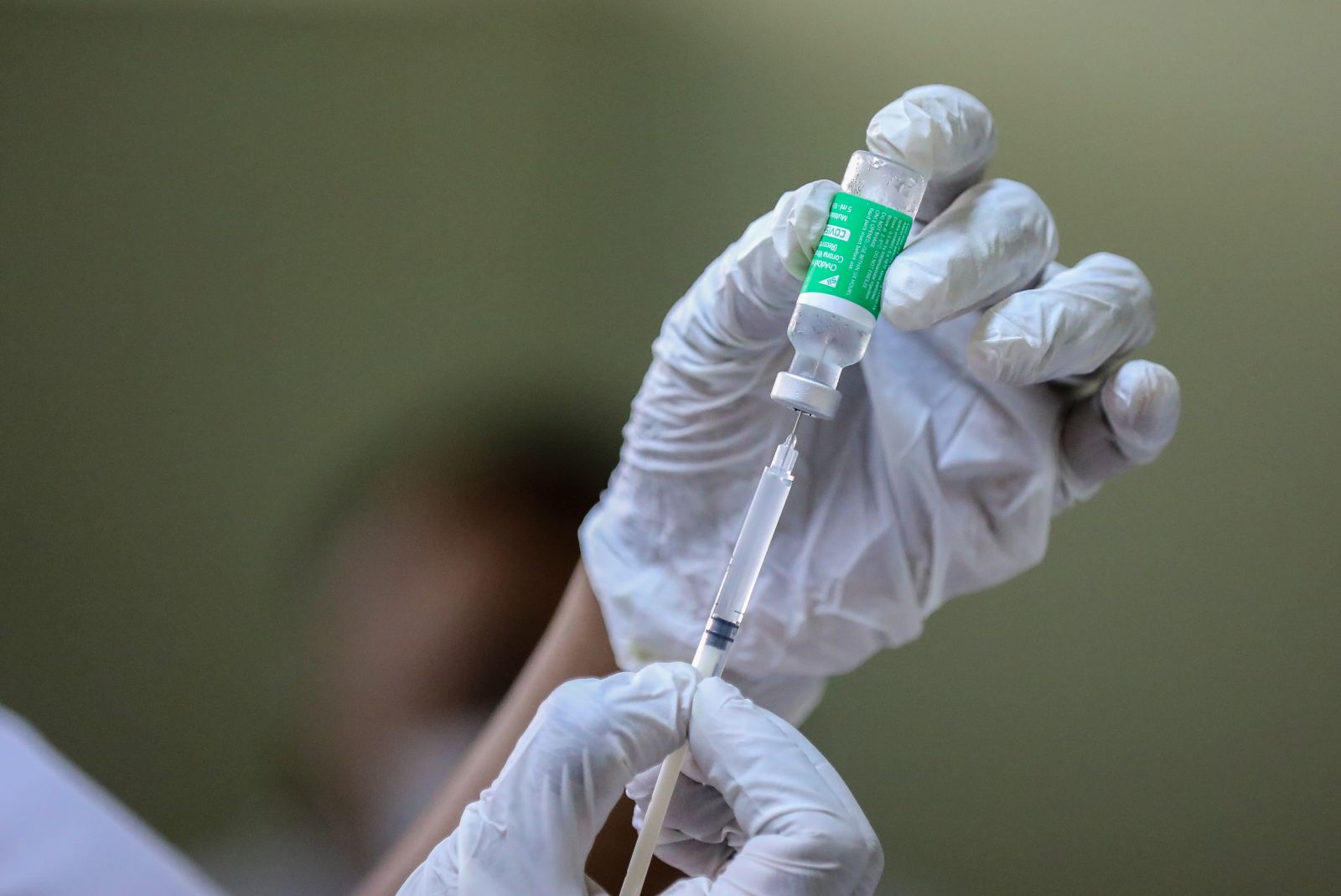 epa09044255 A Sri Lankan health worker prepares to inject a first dose of a Oxford-AstraZeneca COVID-19 vaccine shot at a regional medical clinic in Colombo, Sri Lanka, 01 March 2021. Sri Lanka is in the midst of a new wave of coronavirus disease (COVID-19) infections and the number of cases is increasing day after day. Sri Lankan health authorities started the COVID-19 vaccination drive for the general public on 15 February 2021 after vaccinating frontline workers.  EPA/CHAMILA KARUNARATHNE