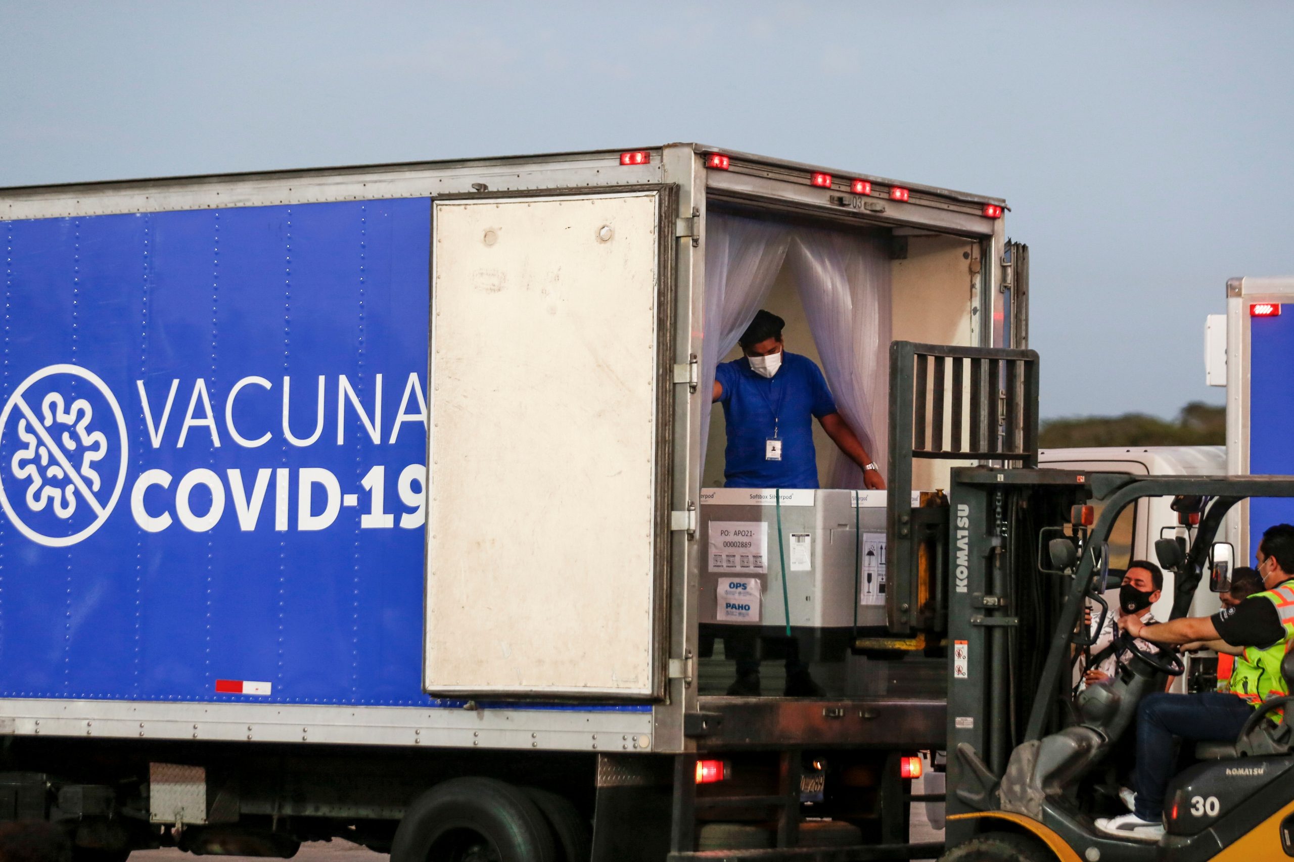 Arrival of AstraZeneca (SKBio Corea) vaccines in El Salvador Containers of AstraZeneca (SKBio Corea) vaccines under the COVAX scheme against the coronavirus disease (COVID-19) are loaded onto a truck after arriving at the Mons. Oscar Arnulfo Romero International Airport, in San Luis Talpa, El Salvador March 11, 2021. REUTERS/Jose Cabezas JOSE CABEZAS