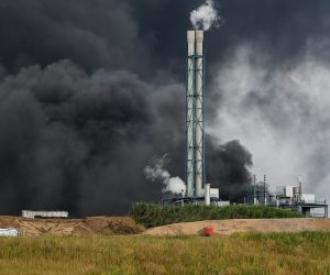 epa09369792 A view of smoke billowing from the chemical industry area of 'Chempark' in Leverkusen, Germany, 27 July 2021. The city of Leverkusen has warned citizens on its official website, that an explosion with an unknown cause occurred on the day at the site of the Chempark. Residents are asked to stay indoors and to keep windows and doors closed.  EPA/SASCHA STEINBACH