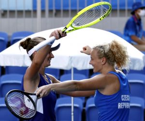 epa09384287 Katerina Siniakova of Czech Republic and Barbora Krejcikova of Czech Republic celebrate after winning their gold medal match against Viktorija Golubic of Switzerland and Belinda Bencic of Switzerland after the Women's Doubles gold medal match during the Tennis events of the Tokyo 2020 Olympic Games at the Ariake Coliseum in Tokyo, Japan, 01 August 2021.  EPA/MAST IRHAM