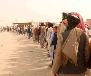 epa09416261 People arrive to go through checking as they prepare to cross into Afghanistan, at Chaman, Pakistan, 16 August 2021. Taliban co-founder Abdul Ghani Baradar on 16 August declared victory and end to the decades-long war in Afghanistan, a day after the insurgents entered Kabul to take control of the country. Baradar, who heads the Taliban political office in Qatar, released a short video message after President Ashraf Ghani fled and conceded that the insurgents had won the 20-year war.  EPA/AKHTER GULFAM