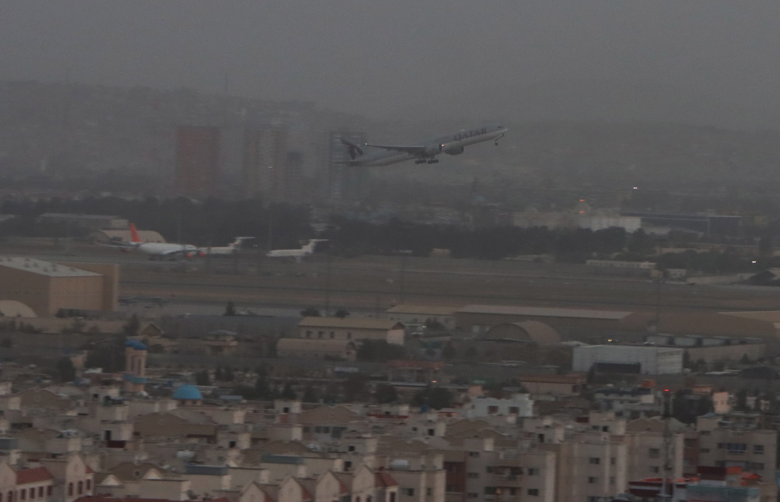 epa09457711 A Qatar Airways flight takes off as international flight operations resumed at Hamid Karzai International Airport in Kabul, Afghanistan, 09 September 2021. A Qatar Airways flight departed from Kabul Airport as Qatari officials said the airport is fully up and running.  EPA/STRINGER