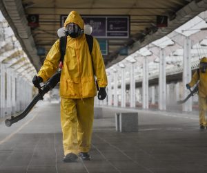 epaselect epa09531810 Worker from the Russian Ministry of Emergency Situations wearing protective suits conduct disinfecting works at Leningradsky Railway Station amid the ongoing coronavirus disease (COVID-19) pandemic in Moscow, Russia, 19 October 2021. Russia is facing a new wave of COVID-19 infections, with additional 998 coronavirus-related deaths reported on 18 October, bringing the official death toll to 22,4310.  EPA/YURI KOCHETKOV