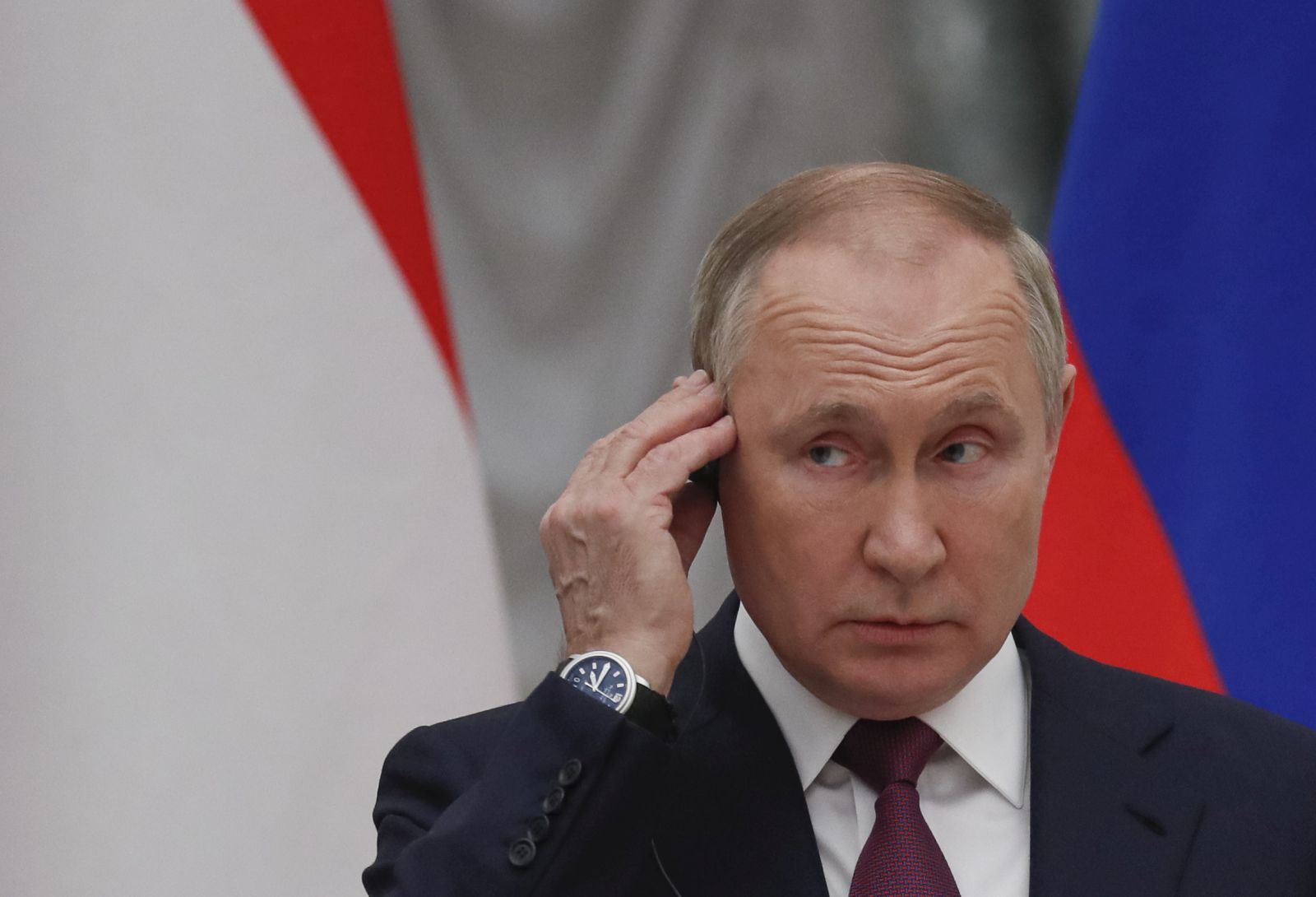 epaselect epa09721568 Russian President Vladimir Putin listens attending the  press-conference with Hungarian Prime Minister Viktor Orban during their meeting in the Moscow Kremlin, Russia, 01 February 2022. Hungary is interested in increasing the volume of Russian gas supplies, Prime Minister Viktor Orban said.  EPA/YURI KOCHETKOV