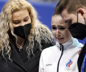 epa09766728 Kamila Valieva (C) of Russian Olympic Committee cries next her coach Eteri Tutberidze (L) after  the Women's Free Skating of the Figure Skating events at the Beijing 2022 Olympic Games, Beijing, China, 17 February 2022.  EPA/HOW HWEE YOUNG