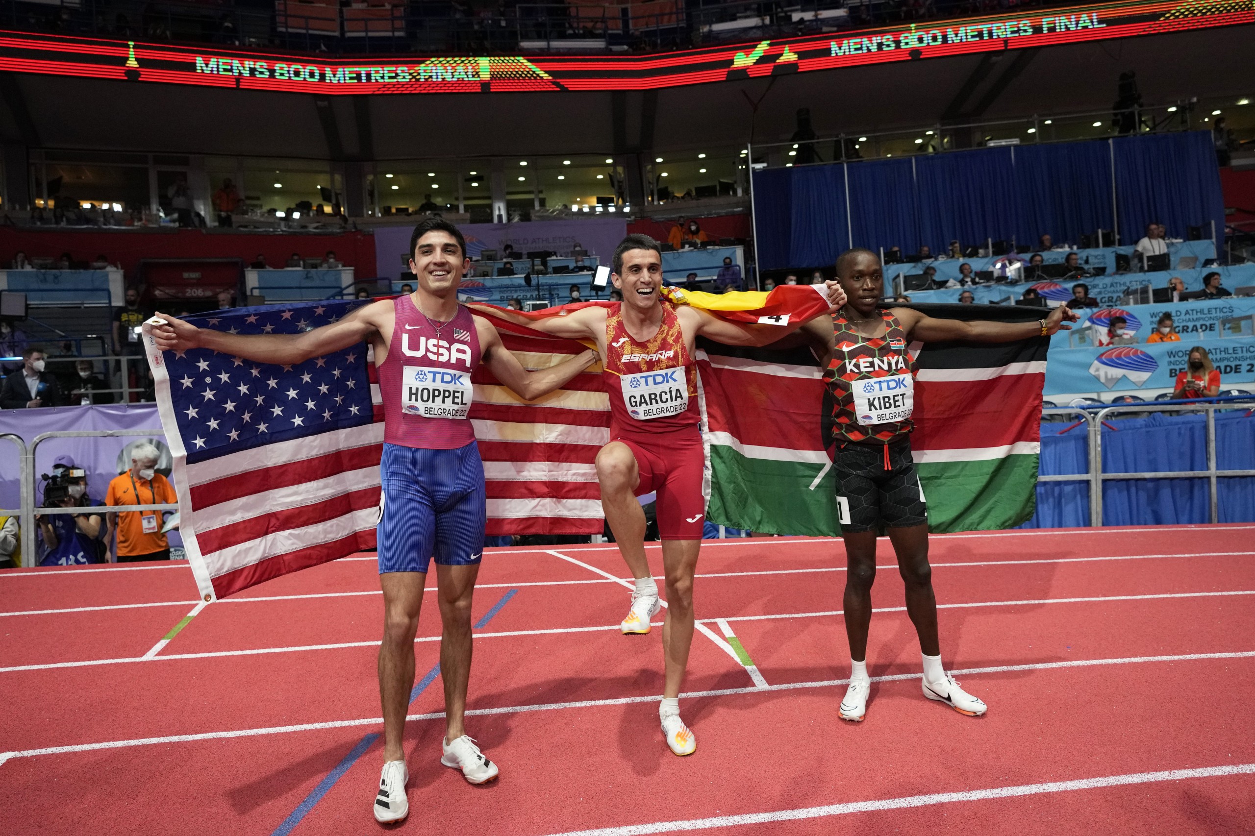 Bronze medalist Bryce Hoppel, of the United States, gold medalist Mariano Garcia, of Spain, and silver medalist Noah Kibet, of Kenya,, from left to right, pose after the Men's 800 meters at the World Athletics Indoor Championships in Belgrade, Serbia, Saturday, March 19, 2022. (AP Photo/Darko Vojinovic)