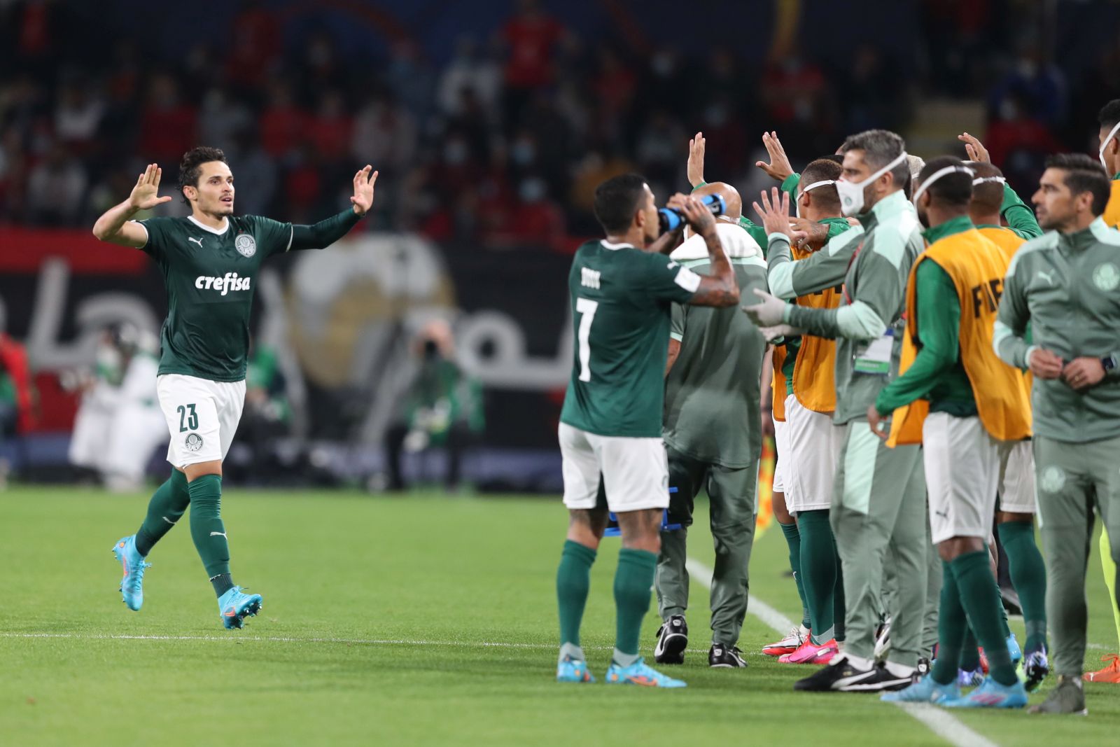 epa09738989 Raphael Veiga (L) of SE Palmeiras celebrates with teammates after scoring the 1-0 lead during the FIFA Club World Cup 2021 semi final soccer match between SE Palmeiras and AL Ahly SC in Abu Dhabi, United Arab Emirates, 08 February 2022.  EPA/ALI HAIDER