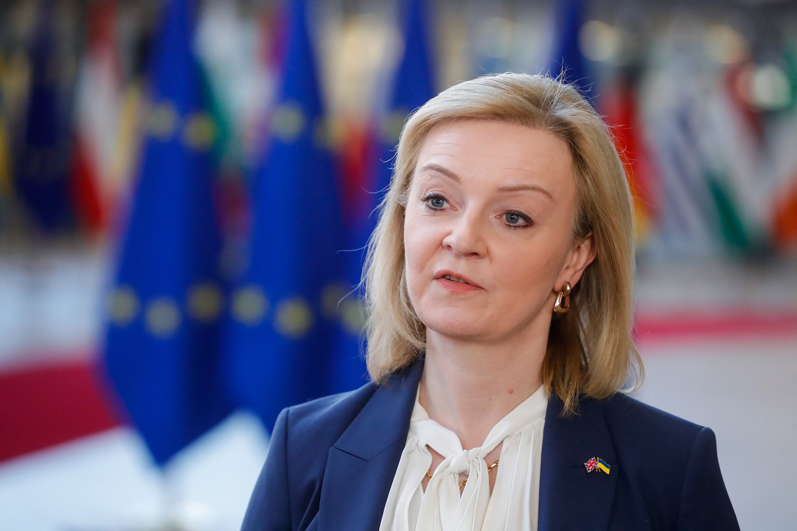 epa09801473 British Secretary of State for Foreign, Commonwealth and Development Affairs and Minister for Women and Equalities Elizabeth Truss speaks to the press ahead of an extraordinary foreign affairs ministers council the European Council in Brussels, Belgium, 04 March 2022.  EPA/STEPHANIE LECOCQ