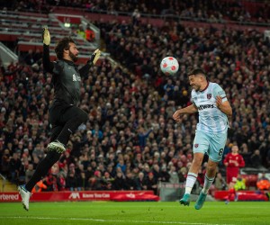 epa09804367 Liverpool's goalkeeper Alisson Becker (L) in action with West Ham United's Pablo Fornals (R) during the English Premier League soccer match between Liverpool FC and West Ham United at Anfield, Liverpool, Britain, 05 March 2022.  EPA/PETER POWELL EDITORIAL USE ONLY. No use with unauthorized audio, video, data, fixture lists, club/league logos or 'live' services. Online in-match use limited to 120 images, no video emulation. No use in betting, games or single club/league/player publications.