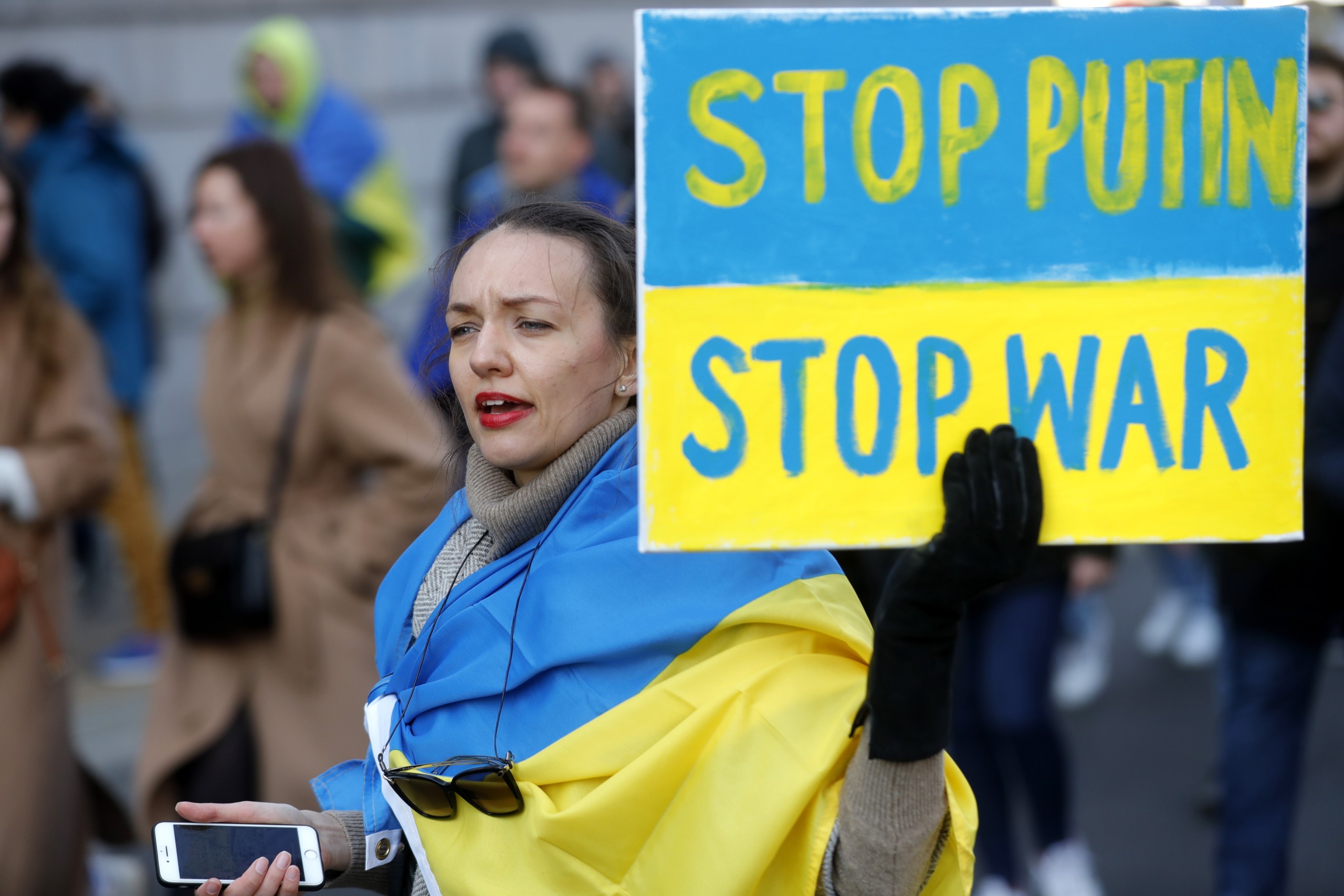 epa09805360 People attend a protest march named 'Stand with Ukraine' against the Russian invasion of Ukraine, in Brussels, Belgium, 06 March 2022. People all over the world hold vigils and demonstrations for peace in the Ukraine and against Russian troops invading the country. Russian troops entered Ukraine on 24 February prompting the country's president to declare martial law and triggering a series of severe economic sanctions imposed by Western countries on Russia.  EPA/STEPHANIE LECOCQ