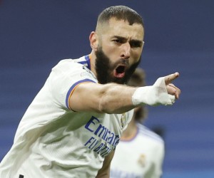 epa09813670 Real Madrid's Karim Benzema celebrates after scoring the 1-1 equalizer during the UEFA Champions League round of 16, second leg soccer match between Real Madrid and Paris Saint-Germain (PSG) in Madrid, Spain, 09 March 2022.  EPA/Juanjo Martin