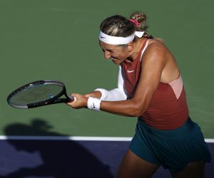 epa09825712 Victoria Azarenka of Belarus in action against Elena Rybakina of Kazakhstan during the BNP Paribas Open tennis tournament at the Indian Wells Tennis Garden in Indian Wells, California, USA, 14 March 2022.  EPA/JOHN G MABANGLO