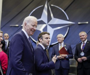 epa09845840 US President Joe Biden (L) and French President Emmanuel Macron (C) arrive for a round table meeting during an extraordinary NATO Summit at the Alliance's headquarters in Brussels, Belgium, 24 March 2022. NATO leaders will address the consequences of Russian President Putin's invasion of Ukraine, discuss the role of China in this crisis, and decide on the next steps to strengthen NATO's deterrence and defence.  EPA/OLIVIER HOSLET