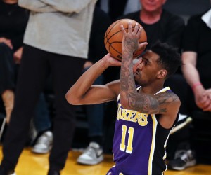 epa09845647 Los Angeles Lakers guard Malik Monk scores a three pointer during the second quarter of the NBA basketball game between the Los Angeles Lakers and the Philadelphia 76ers at the Crypto.com Arena in Los Angeles, California, USA, 23 March 2022.  EPA/ETIENNE LAURENT SHUTTERSTOCK OUT