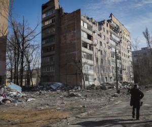 epa09884757 A local man walks near the place where, two weeks ago, an apartment building was destroyed as a result of a 'Uragan' missile hit, in Donetsk, Ukraine, 11 April 2022. In the self-proclaimed Donetsk People's Republic (DPR), 261 people died from 01 April to 07 April, the press service of the Commissioner for Human Rights in the republic reports. In total, 6,271 deaths have been registered in the DPR since the spring of 2014, including 96 children. On 24 February Russian troops had entered Ukrainian territory in what the Russian president declared a 'special military operation', resulting in fighting and destruction in the country, a huge flow of refugees, and multiple sanctions against Russia.  EPA/SERGEI ILNITSKY