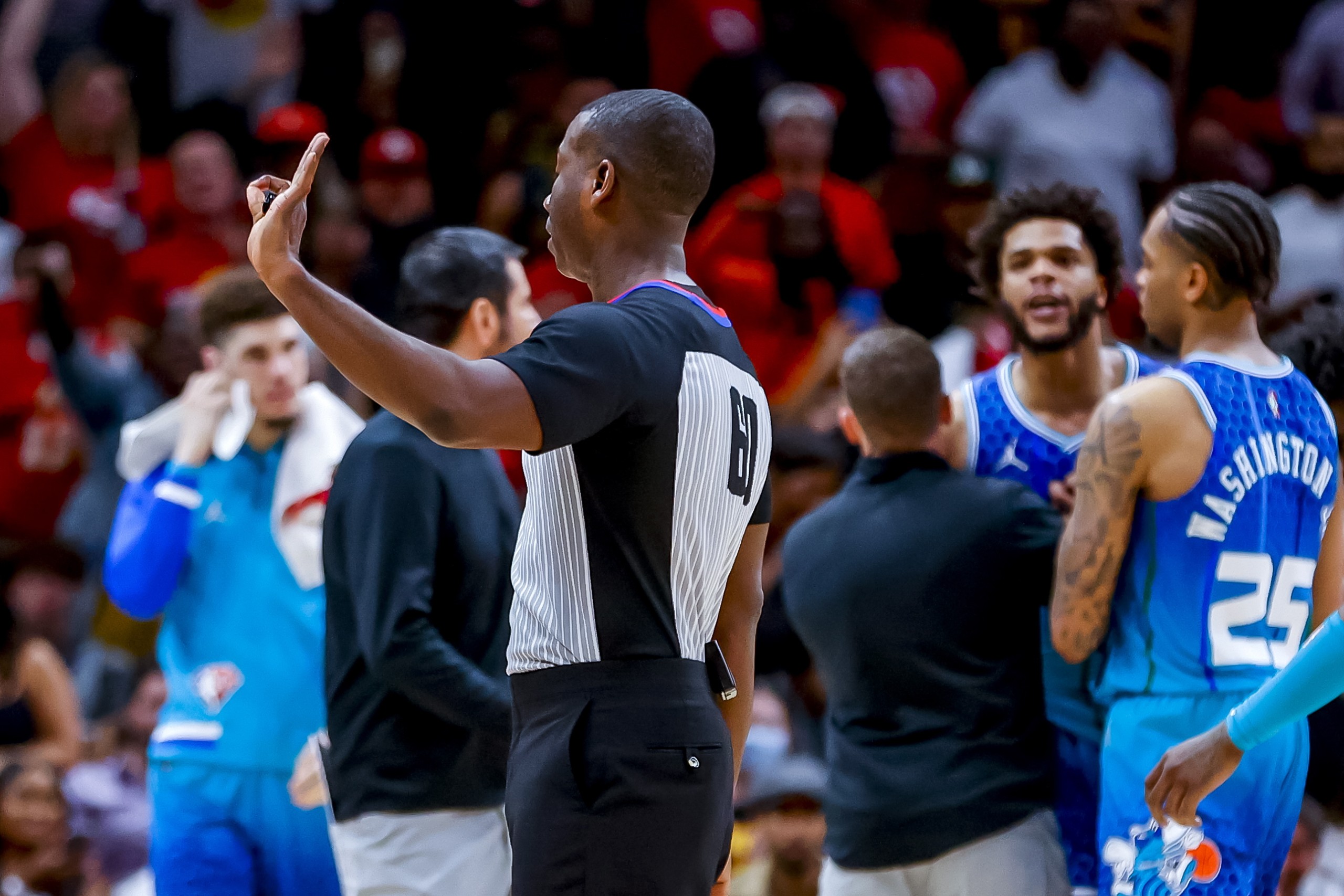 epa09889017 Charlotte Hornets forward Miles Bridges (R) is ejected from the game by referee James Williams during the second half of the NBA basketball Play-In Tournament game between the Charlotte Hornets and the Atlanta Hawks at State Farm Arena in Atlanta, Georgia, USA, 13 April 2022.  EPA/ERIK S. LESSER SHUTTERSTOCK OUT