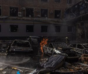 epa09892992 Ukrainian firefighters work next to damaged buildings in the area that was hit by the Russian artillery shelling, in Kharkiv, northeast Ukraine, 16 April 2022. Kharkiv, Ukraine's second-largest city and its surrounding area have been heavily shelled by Russian forces, with many civilians killed, since Russia's military invasion of Ukraine began on 24 February 2022.  EPA/ROMAN PILIPEY