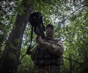 epa10002415 A Ukrainian serviceman keeps watch near the frontlines of Izium south of Kharkiv, Ukraine, 08 June 2022. In the past weeks Russia has intensified its operation in the eastern Ukraine region. Russian troops had entered Ukrainian territory on 24 February causing fighting and destruction and a humanitarian crisis. According to the UNHCR, more than 6.9 million refugees have fled Ukraine, and a further 7.7 million people have been displaced internally within Ukraine since.  EPA/MARIA SENOVILLA