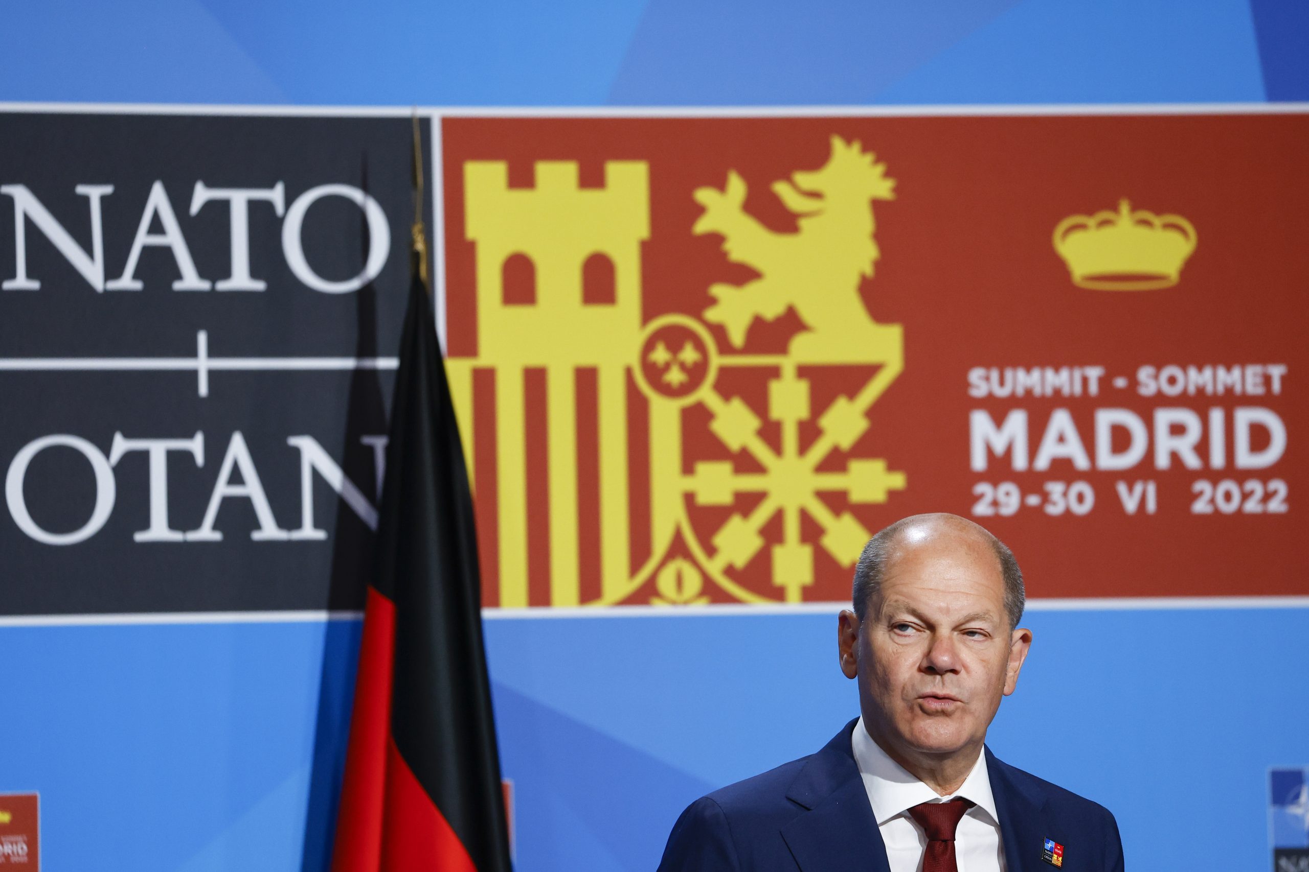 epa10043317 German Chancellor Olaf Scholz addresses a press conference during the second and last day of the NATO Summit at IFEMA Convention Center in Madrid, Spain, 30 June 2022. Heads of State and Government from NATO's member countries and key partners are gathering in Madrid to discuss important issues facing the Alliance and endorse NATO's new Strategic Concept, the Organization said. Spain is hosting the 2022 NATO Summit coinciding with the 40th anniversary of its accession to NATO.  EPA/SERGIO PEREZ