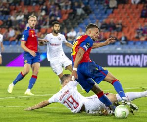 epa10171261 Pyunik's Serhij Wakulenko (bottom) in action against Basel's Darian Males (R) during the UEFA Europa Conference League group H soccer match between FC Basel and FC Pyunik Yerevan in Basel, Switzerland, 08 September 2022.  EPA/GEORGIOS KEFALAS