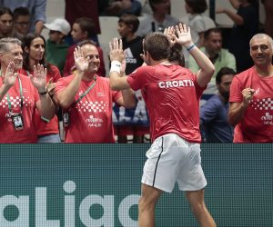 epa10186453 Borna Coric (front) of Croatia celebrates with team members after defeating Mikael Ymer of Sweden during the Davis Cup Finals group A tie between Croatia and Sweden in Casalecchio, near Bologna, Italy, 15 September 2022.  EPA/ELISABETTA BARACCHI