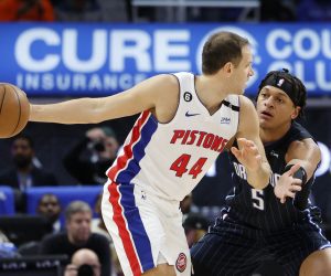 Oct 19, 2022; Detroit, Michigan, USA;  Detroit Pistons forward Bojan Bogdanovic (44) is defended by Orlando Magic forward Paolo Banchero (5) in the first half at Little Caesars Arena. Mandatory Credit: Rick Osentoski-USA TODAY Sports