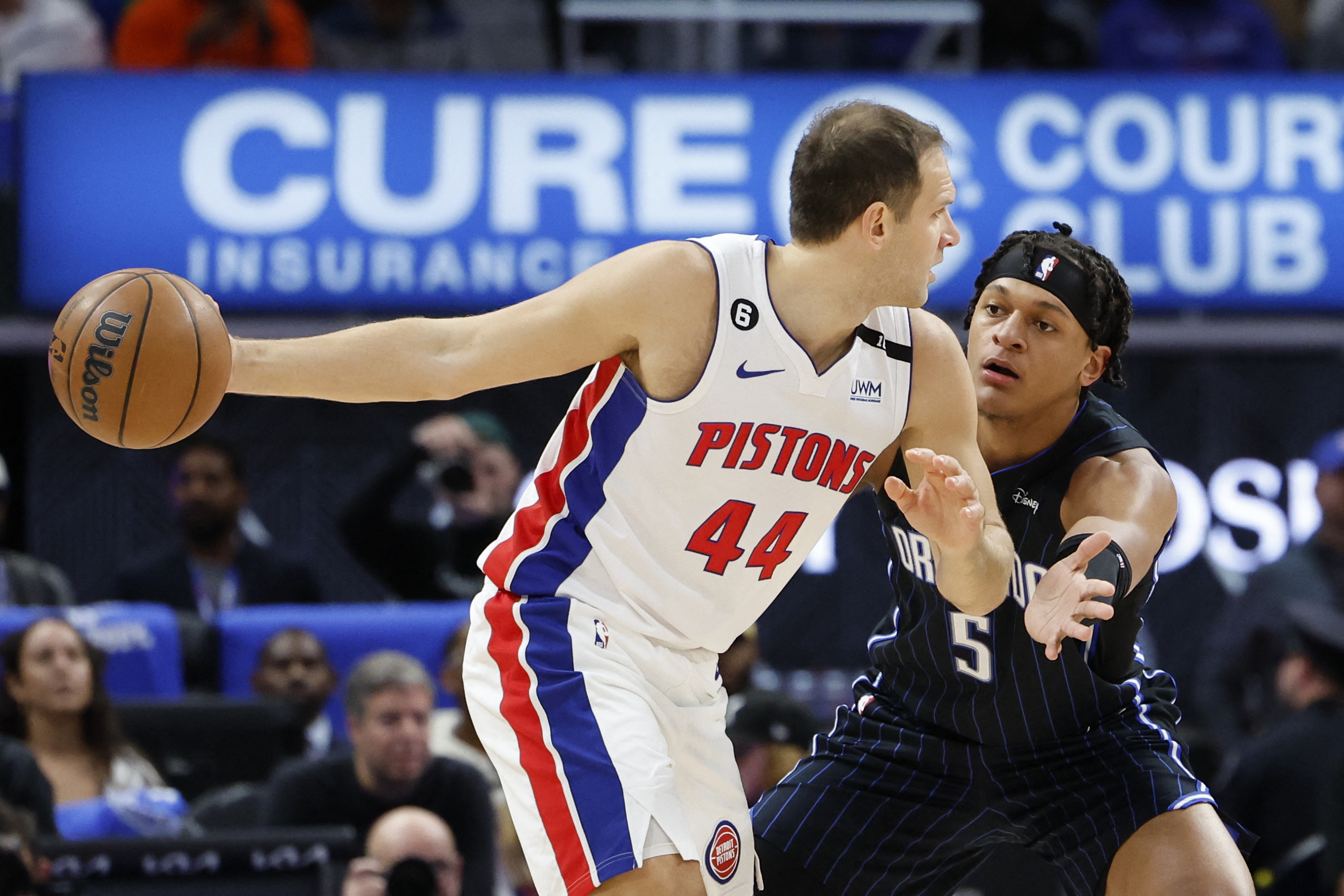 Oct 19, 2022; Detroit, Michigan, USA;  Detroit Pistons forward Bojan Bogdanovic (44) is defended by Orlando Magic forward Paolo Banchero (5) in the first half at Little Caesars Arena. Mandatory Credit: Rick Osentoski-USA TODAY Sports