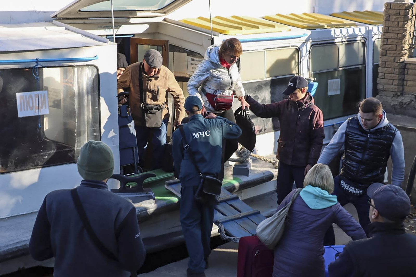 epa10252885 A still image taken from an undated handout video provided by the Kherson City Administration web source on 19 October 2022 shows local people disembarking from a river ship during evacuations in Kherson, southern Ukraine (issued 19 October 2022). The civilian population of four municipalities of the Kherson region will be moved to the left bank of the Dnieper, Kherson Region acting Governor Vladimir Saldo said on his official Telegram channel. He said the measure was a precaution due to the tense situation on the line of contact and increased threat of rocket and artillery strikes on the territory of the Kherson region and the city of Kherson. On 24 February 2022 Russian troops entered the Ukrainian territory in what the Russian president declared as a 'Special Military Operation', starting an armed conflict that has provoked destruction and a humanitarian crisis.  EPA/KHERSON CITY ADMINISTARTION HANDOUT -- BEST QUALITY AVAILABLE -- HANDOUT EDITORIAL USE ONLY/NO SALES