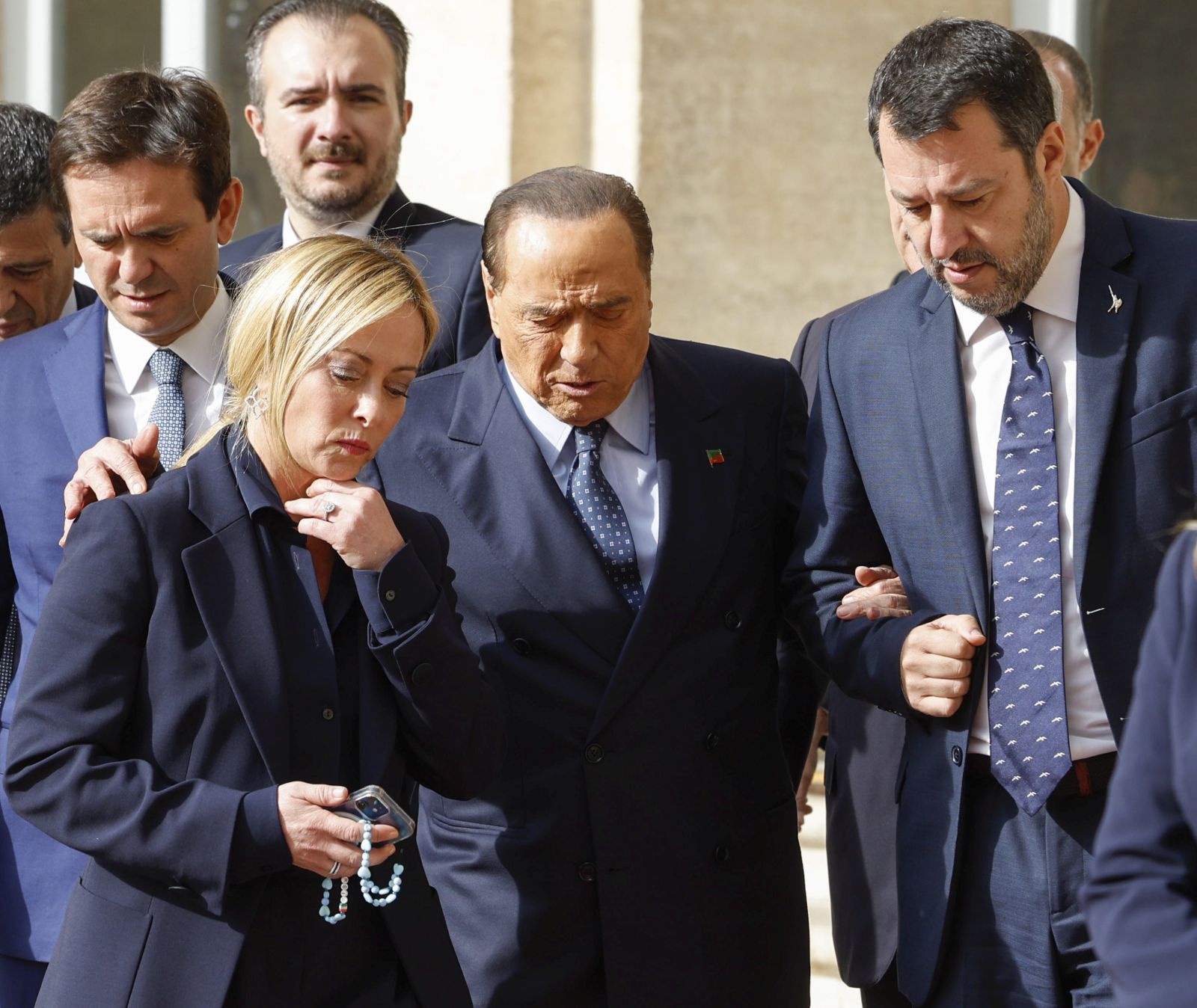 epa10256445 Leader of 'Brothers of Italy' (Fratelli d'Italia) Giorgia Meloni (L), leader of 'Forza Italia' party Silvio Berlusconi (C) and League leader Matteo Salvini (R) leave after a meeting with Italian president for the first round of formal political consultations for new government at the Quirinale Palace in Rome, Italy, 21 October 2022.  EPA/FABIO FRUSTACI