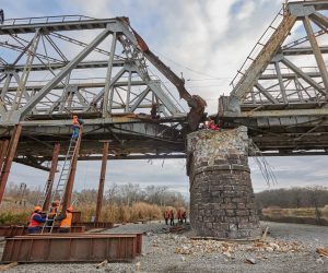 epa10282254 Workers repair a railway bridge after it was damaged in fighting between the Ukrainian and Russian armies in the town of Kupiansk, in Kharkiv region, Ukraine, 02 November 2022. The railway normally connects Kupiansk with Kharkiv which was retaken by the Ukrainian forces in September. Russian troops on 24 February entered Ukrainian territory, starting a conflict that has provoked destruction and a humanitarian crisis.  EPA/SERGIY KOZLOV