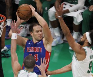 epa10297273 Detroit Pistons forward Bojan Bogdanovic (C) looks to make a pass around defending Boston Celtics guard Payton Pritchard (L)  and Boston Celtics guard Derrick White (R) during the third quarter at the TD Garden in Boston, Massachusetts, USA, 09 November 2022.  EPA/CJ GUNTHER SHUTTERSTOCK OUT