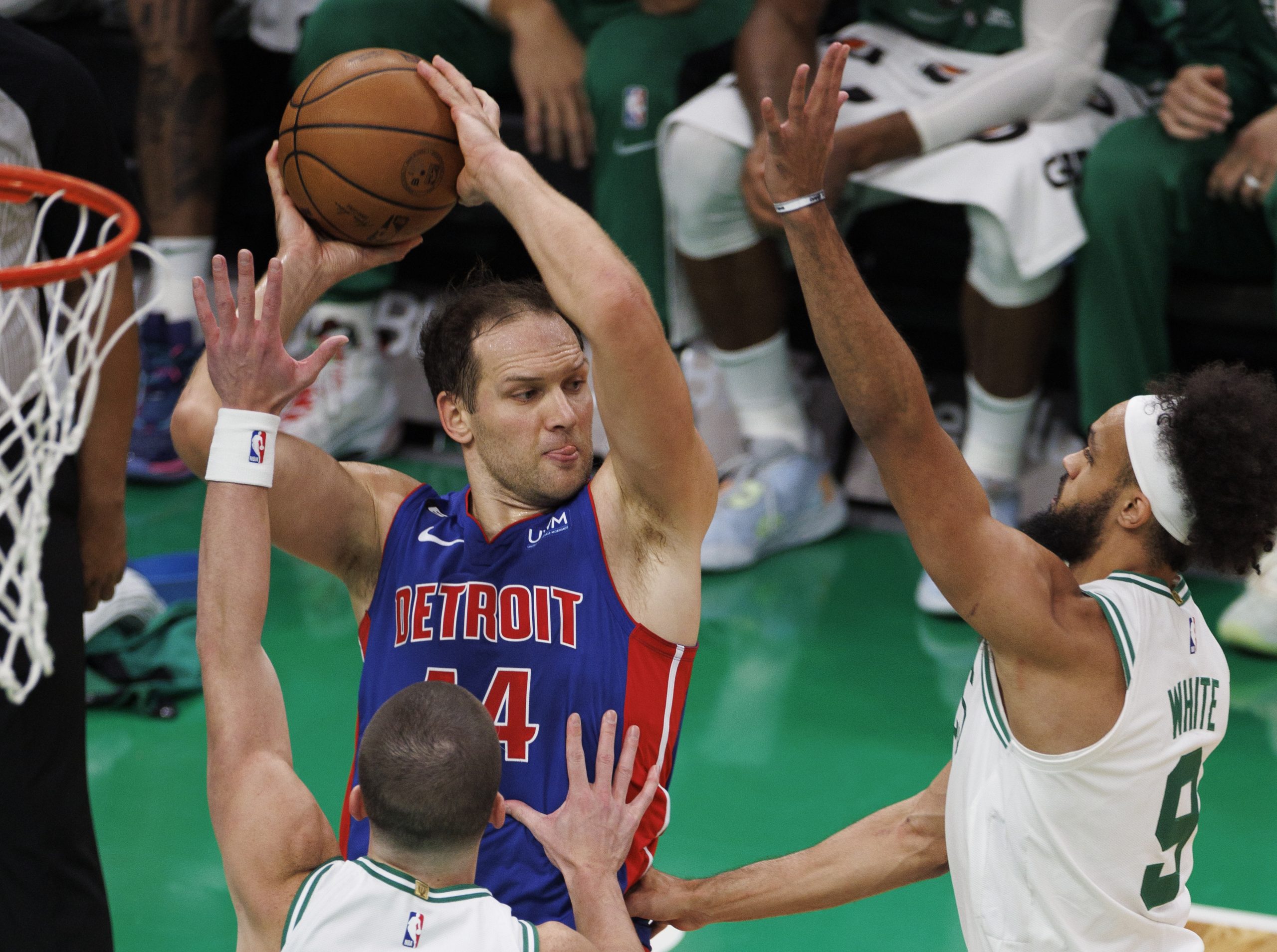 epa10297273 Detroit Pistons forward Bojan Bogdanovic (C) looks to make a pass around defending Boston Celtics guard Payton Pritchard (L)  and Boston Celtics guard Derrick White (R) during the third quarter at the TD Garden in Boston, Massachusetts, USA, 09 November 2022.  EPA/CJ GUNTHER SHUTTERSTOCK OUT